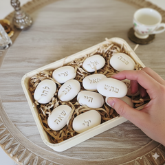 Meditation scene with a single ceramic stone engraved with Hebrew letters from the 72 names