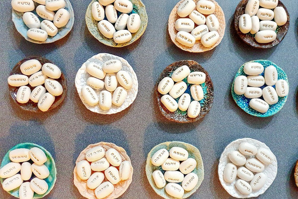 A bowl with Hebrew blessing stones