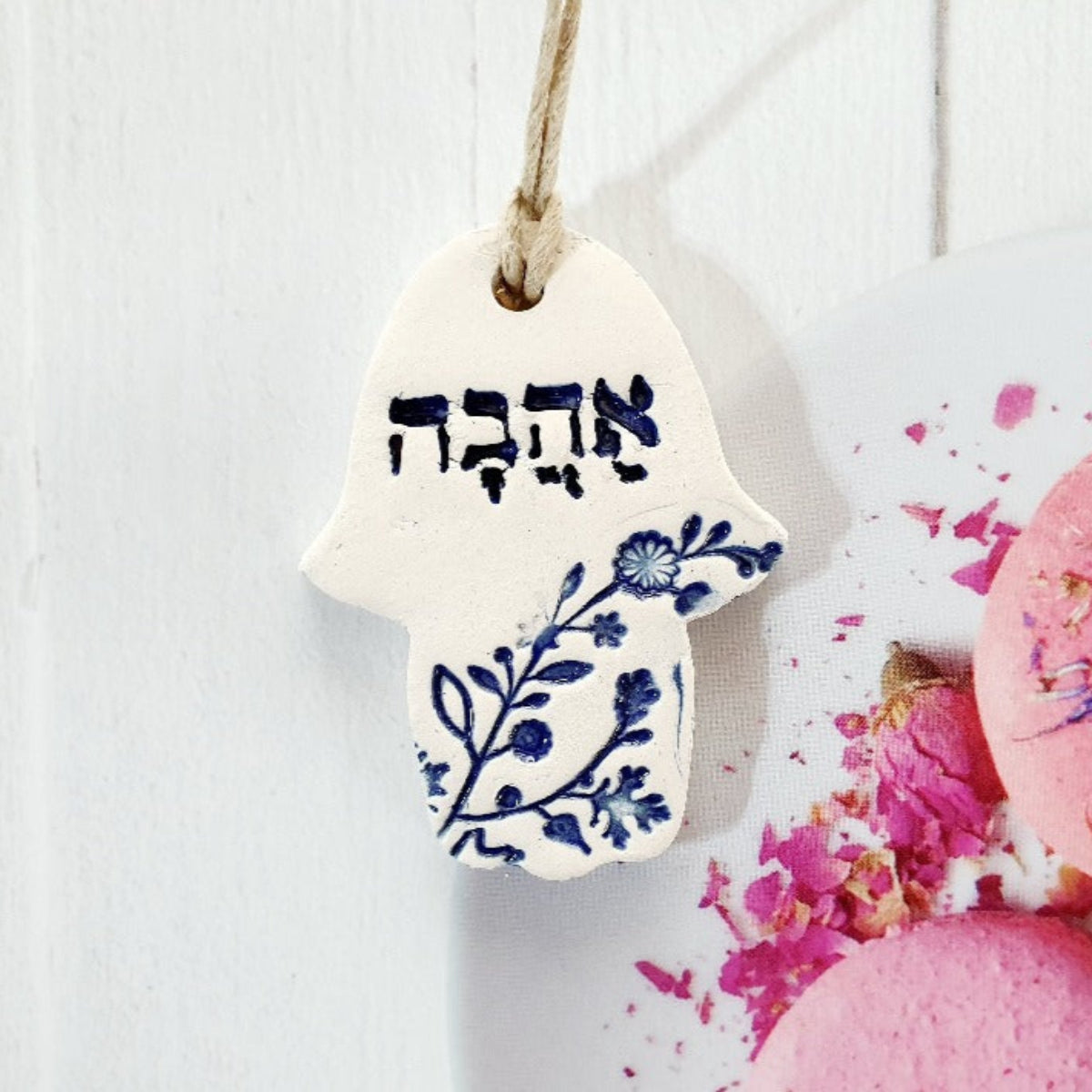 Ceramic Hamsa with theword love in Hebrew