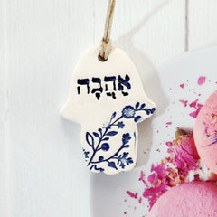 Ceramic Hamsa with theword love in Hebrew