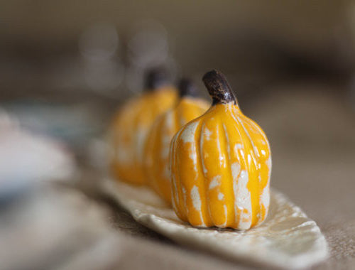 Yellow and white ceramic pumpkins